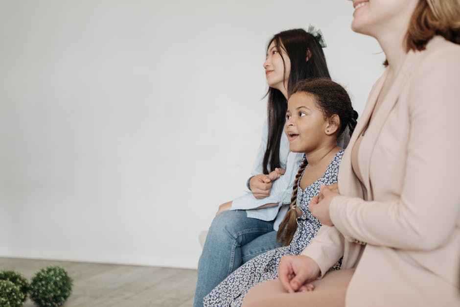 Group of diverse people smiling and sitting comfortably after a yoga practice.